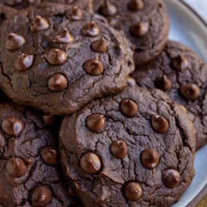 Chocolate pumpkin cookies on a plate, ready to eat.