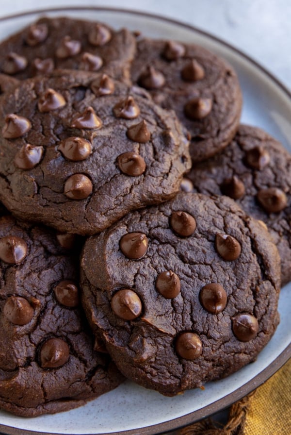 Chocolate pumpkin cookies on a plate, ready to eat.