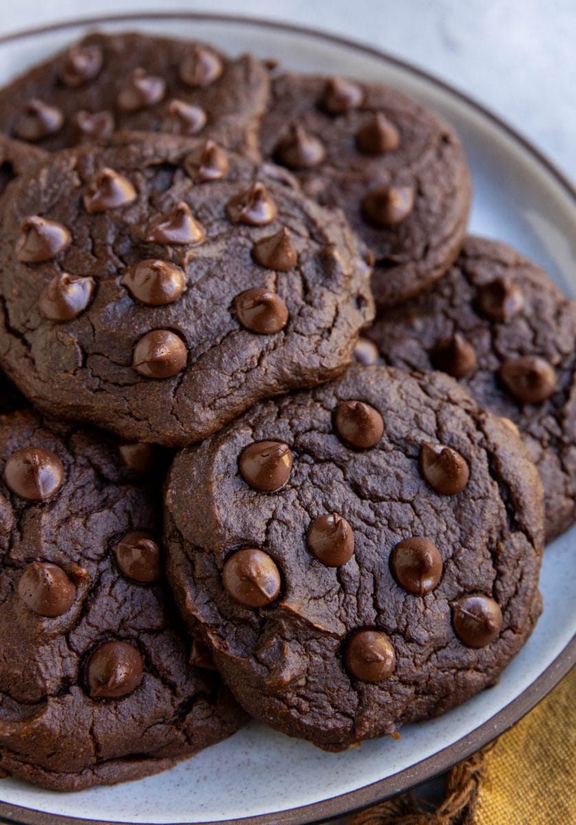 Chocolate pumpkin cookies on a plate, ready to eat.