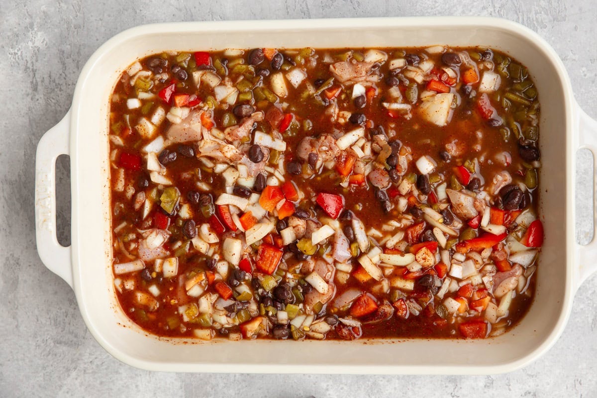 Casserole dish with ingredients mixed up.