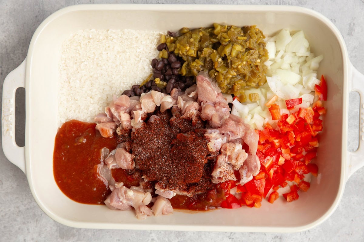 Casserole dish full of ingredients for chicken taco casserole.