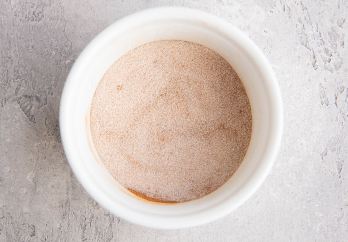 Bowl with cinnamon and sugar mixed together.