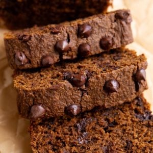 Sweet potato bread cut into slices and a golden napkin, ready to serve.