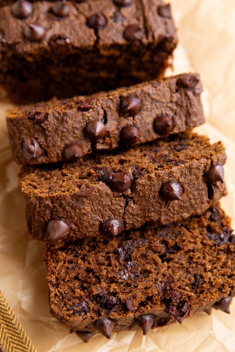 Sweet potato bread cut into slices and a golden napkin, ready to serve.