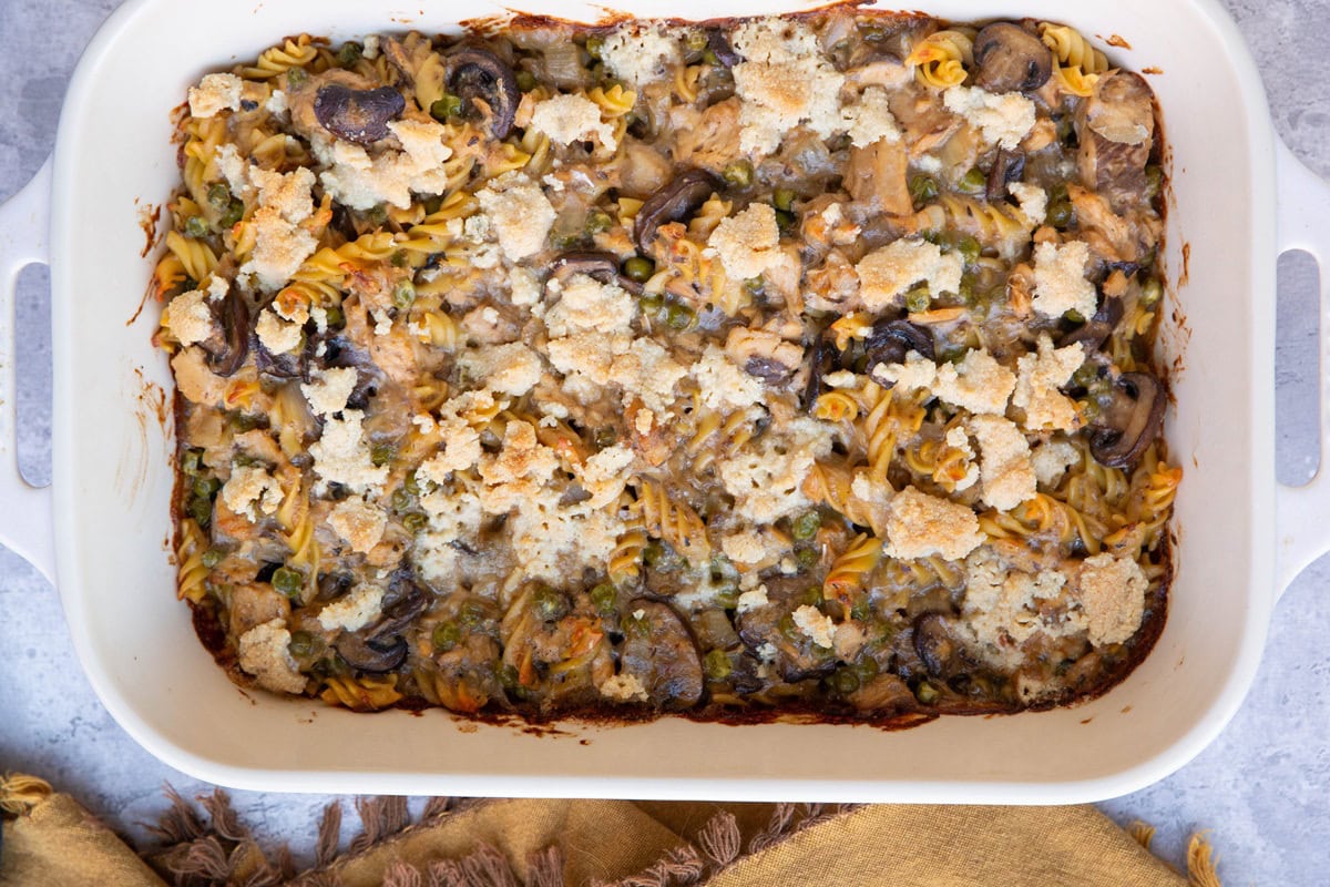 Casserole dish full of salmon noodle casserole.