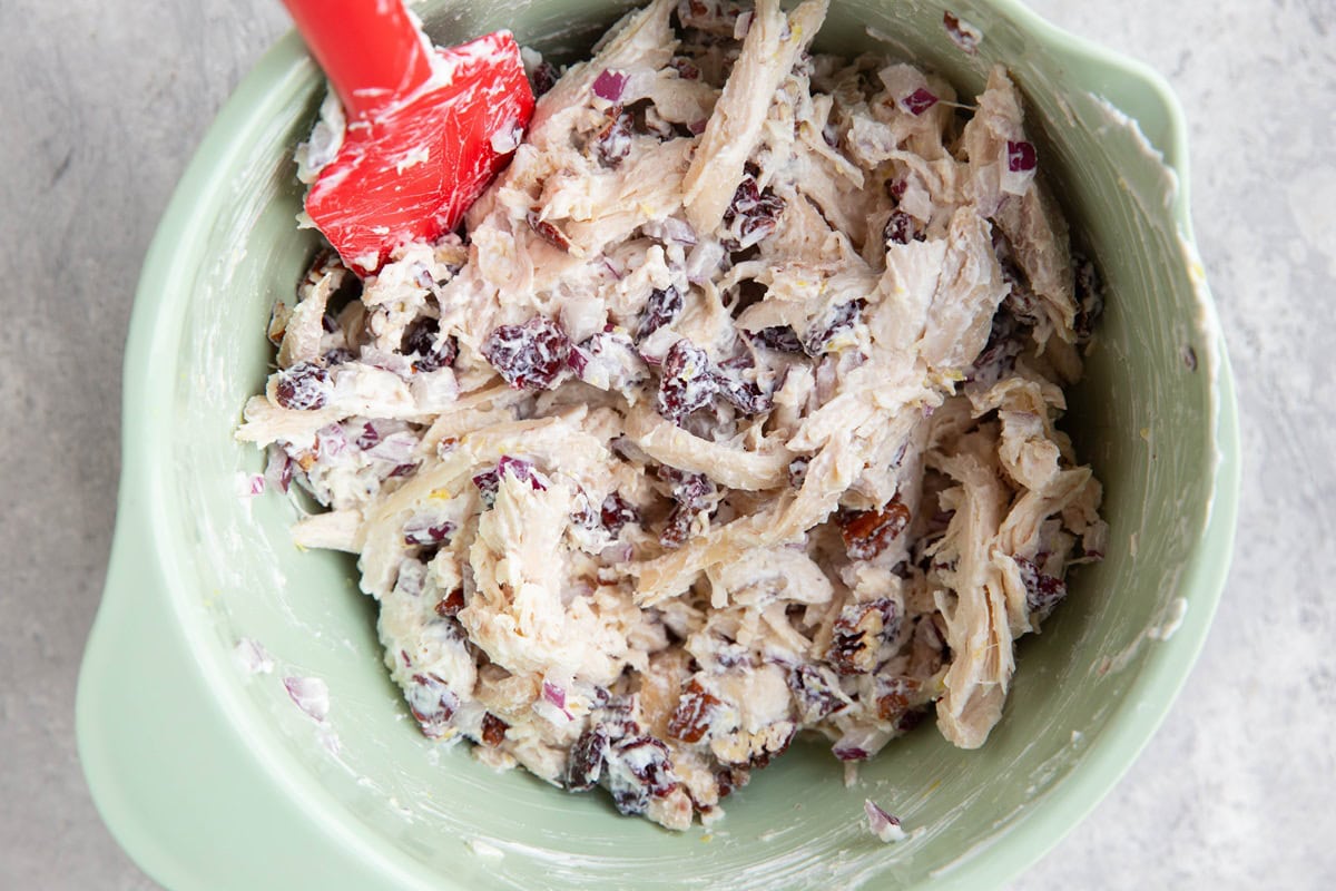 Mixing bowl full of cranberry pecan turkey salad, all mixed up and ready to use.