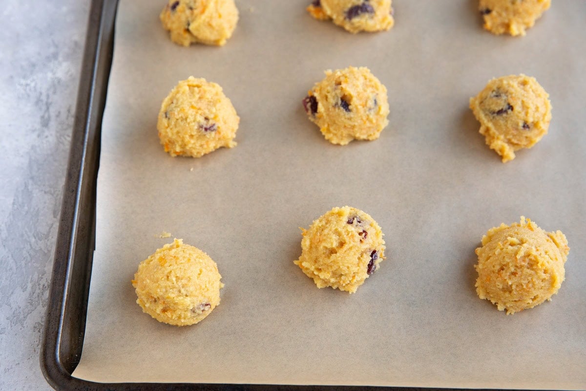 Baking sheet full of cranberry orange cookie dough, ready to go into the oven.