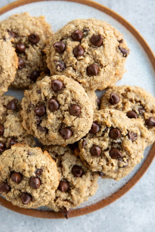 Large plate of oatmeal almond flour cookies with chocolate chips, ready to serve.