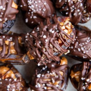 Stack of many date snickers on a plate, ready to serve.
