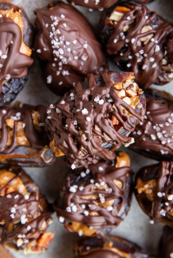 Stack of many date snickers on a plate, ready to serve.