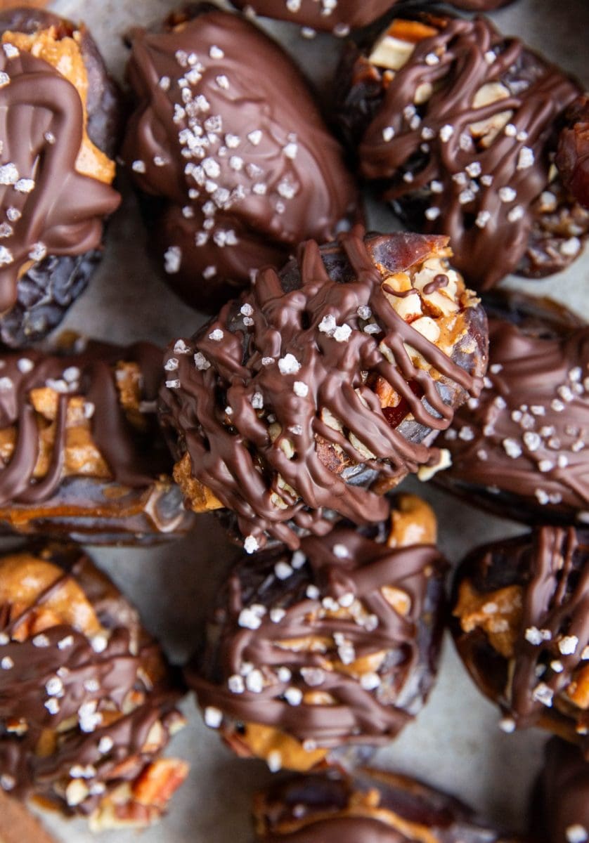 Stack of many date snickers on a plate, ready to serve.