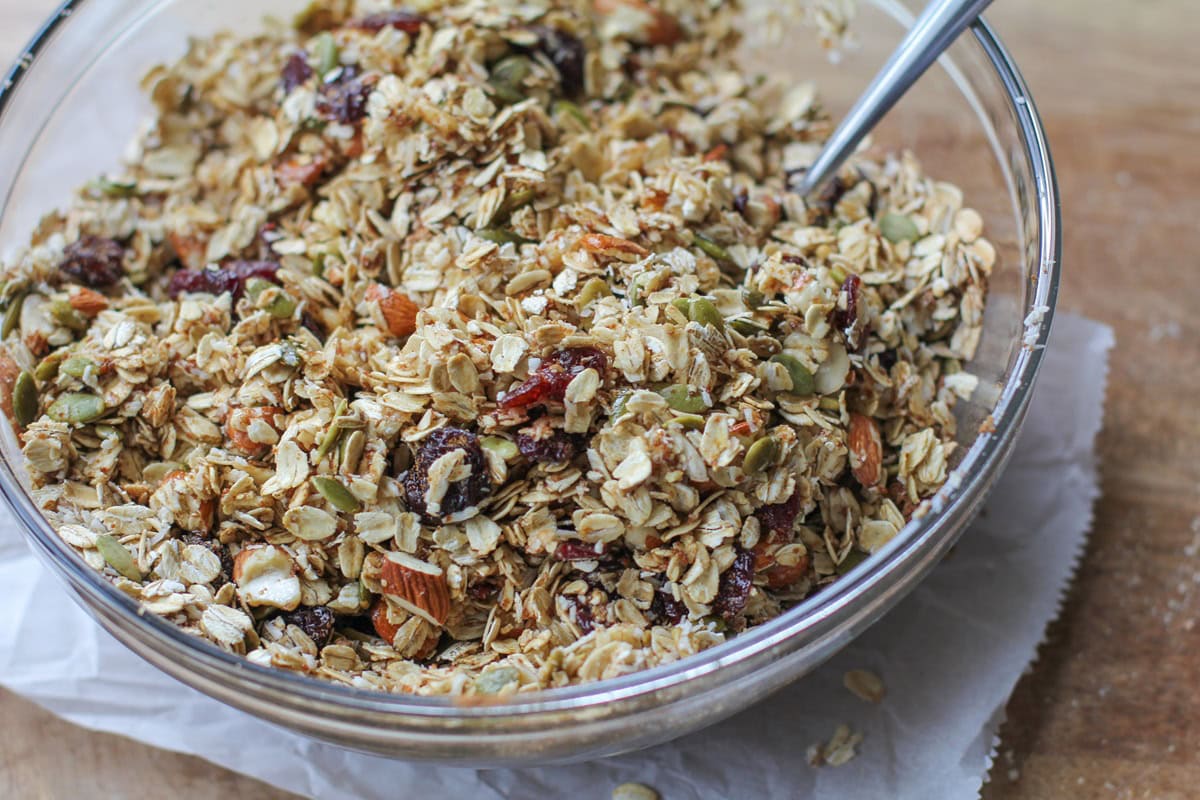 Granola ingredients mixed up in a bowl, ready to make.
