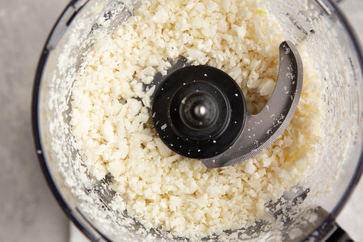 Food processor full of riced cauliflower