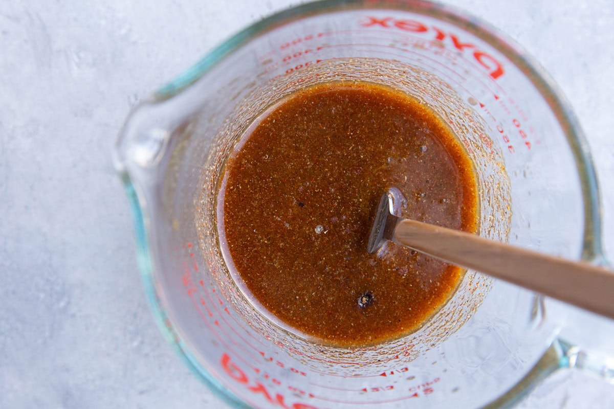 Shawarma marinade in a measuring cup, ready to use.
