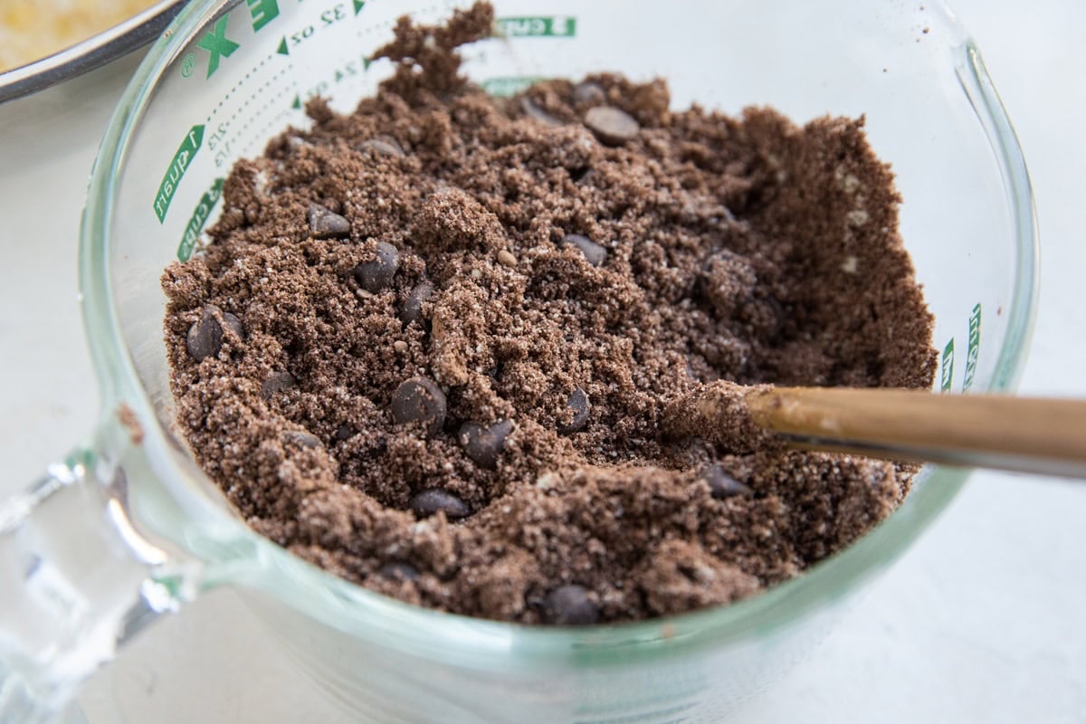 Large mixing bowl full of cocoa powder and almond flour mixed together.