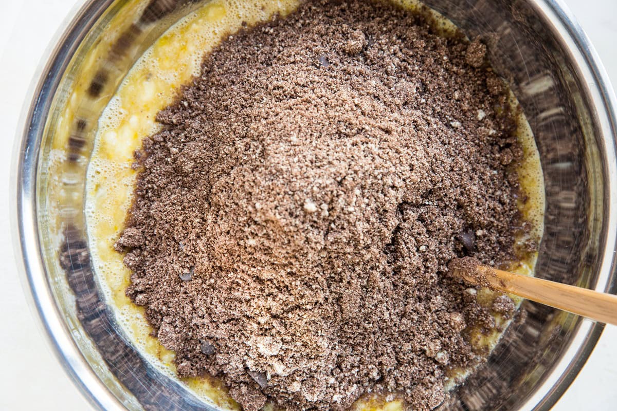 Mixing bowl with wet ingredients on the bottom and dry ingredients on top.