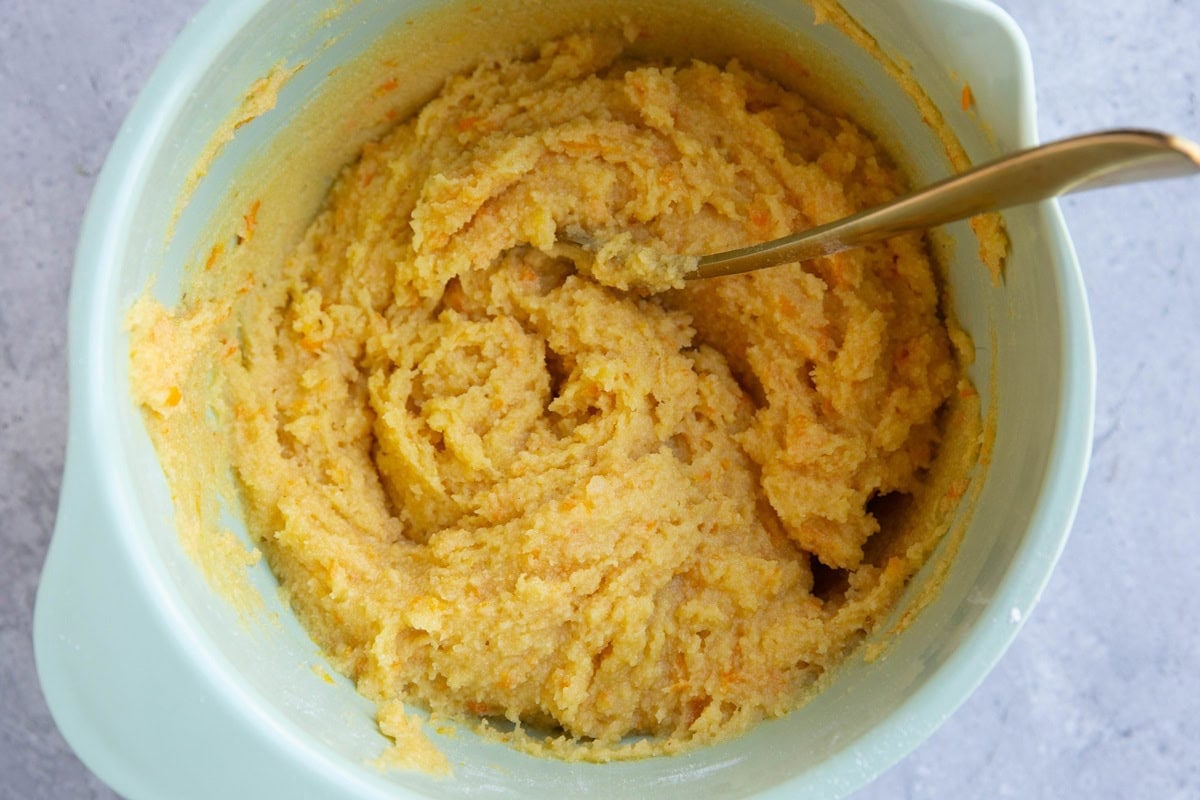 Orange pound cake batter in a mixing bowl, mixed up and ready to use.