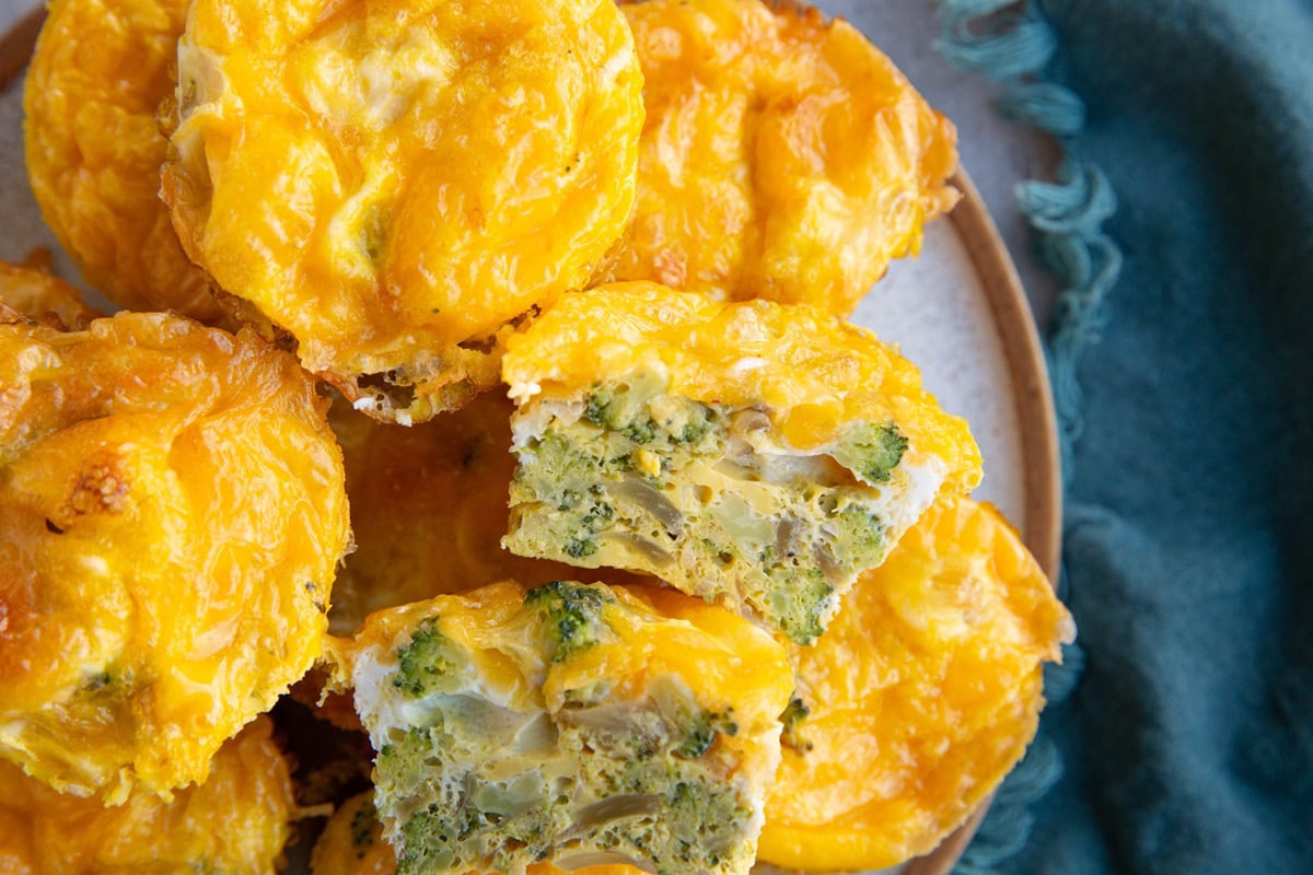 Plate of broccoli cheddar egg muffins, ready to serve.