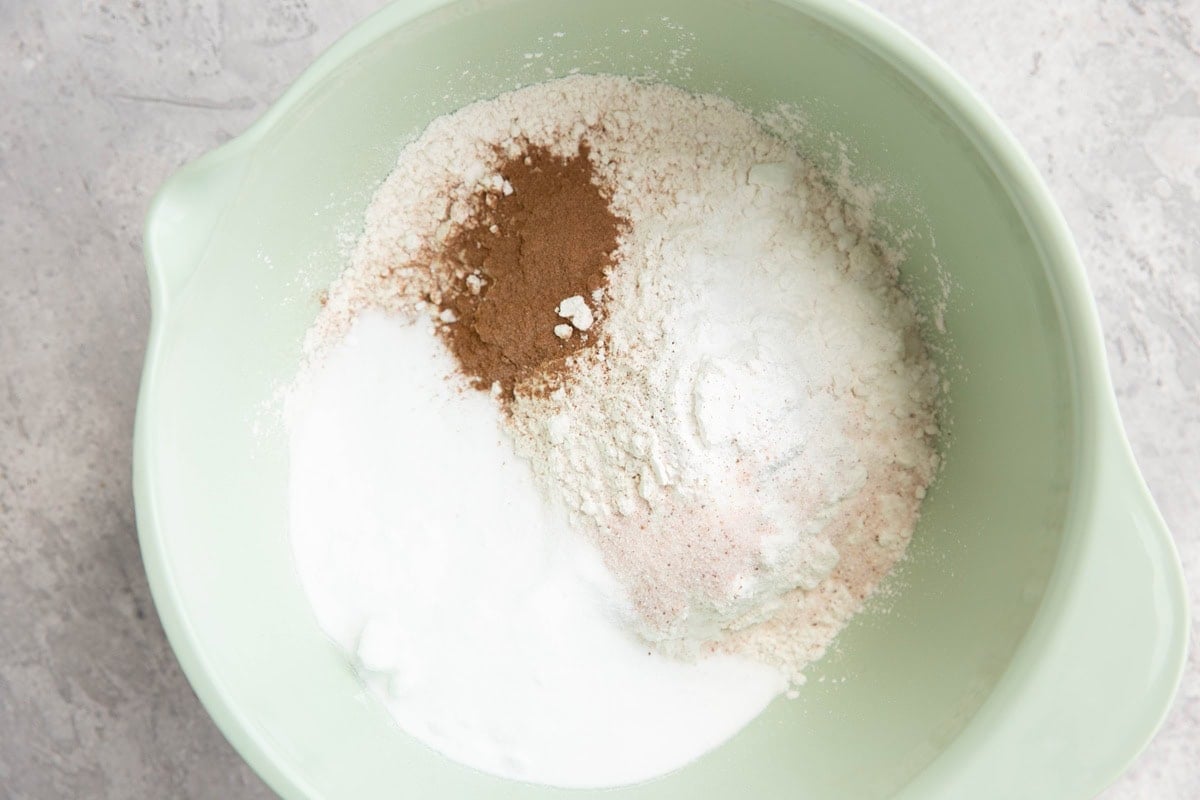 Flour, sugar, cinnamon, and salt in a large mixing bowl to make scones.
