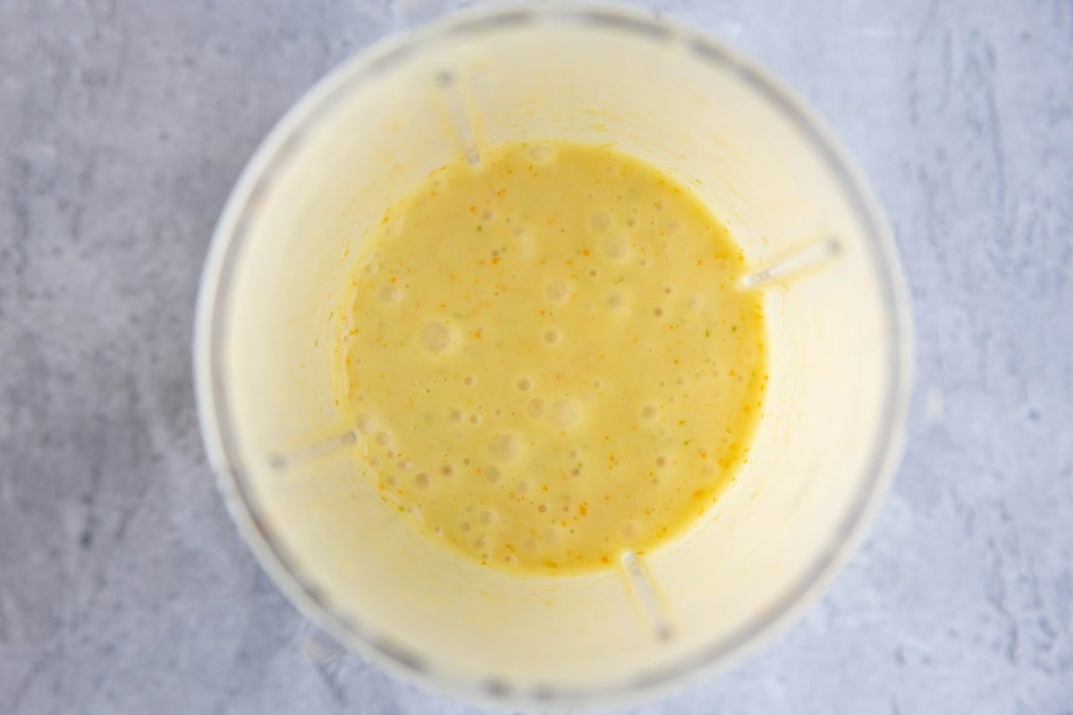 small blender full of mojo sauce, blended up and ready to use.