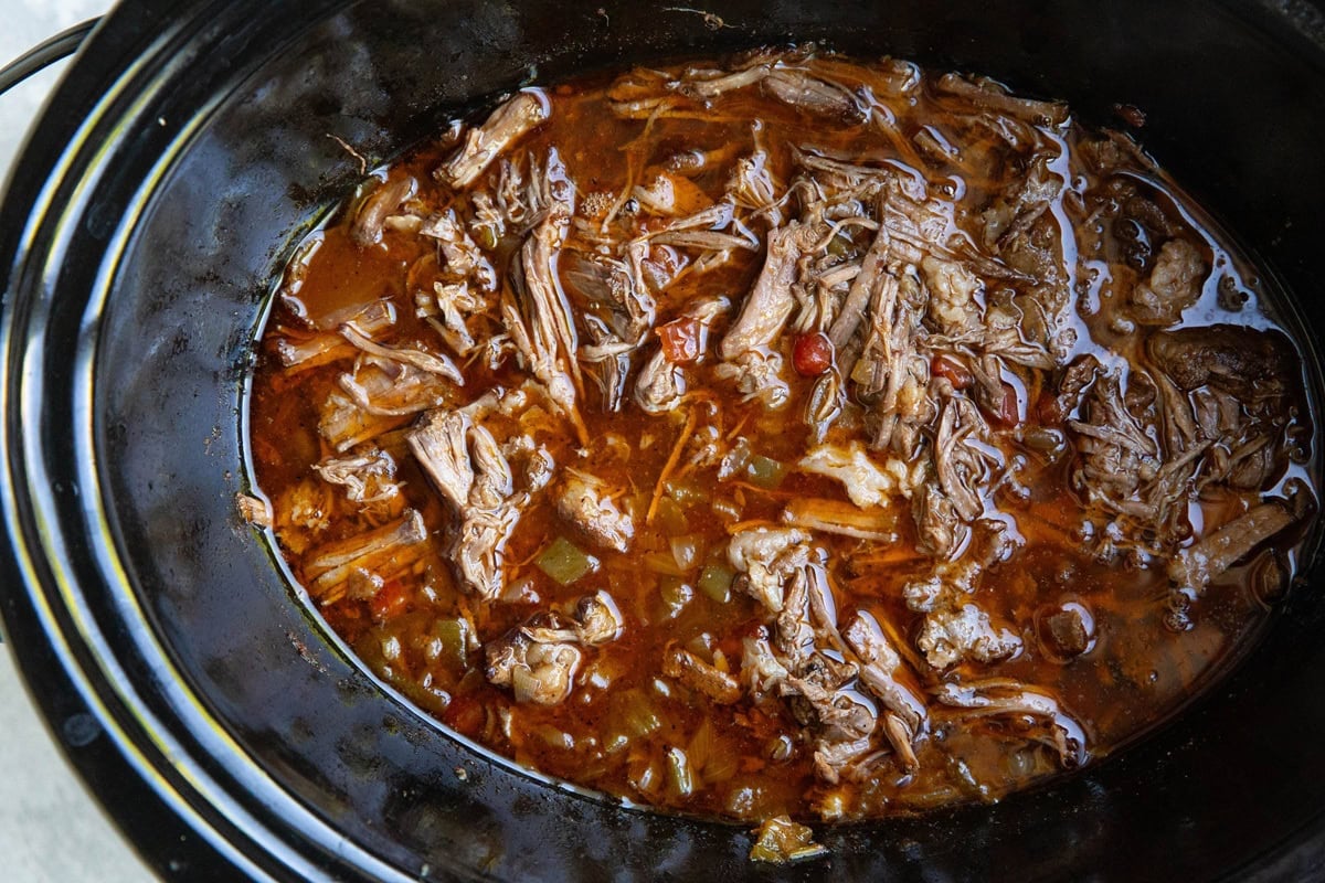 Slow cooker full of shredded beef machaca, ready to serve.