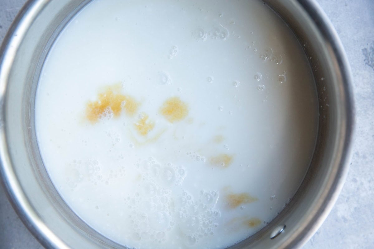 Saucepan with milk and extract to make an ice cream base.