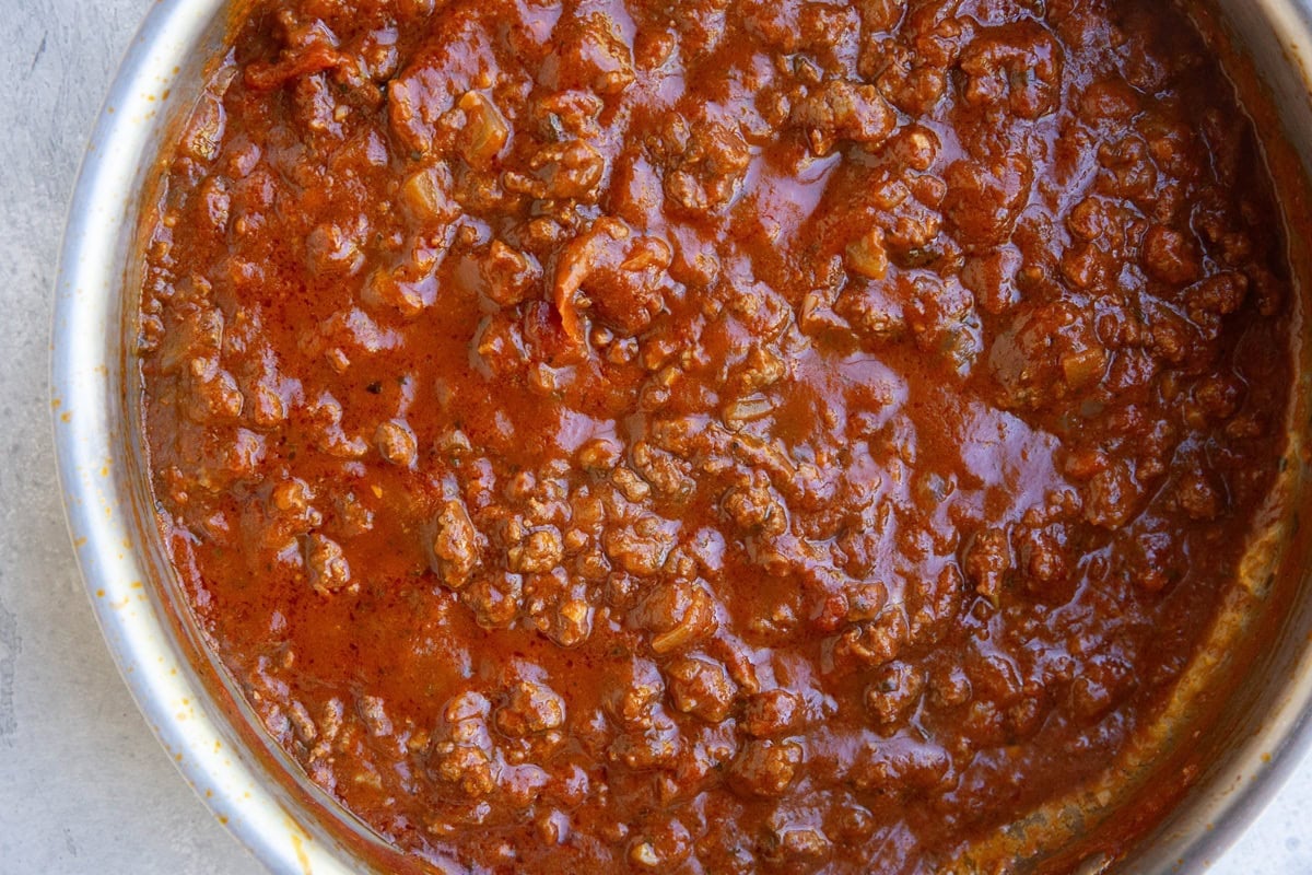 Skillet with tomato meat sauce inside, ready to use.