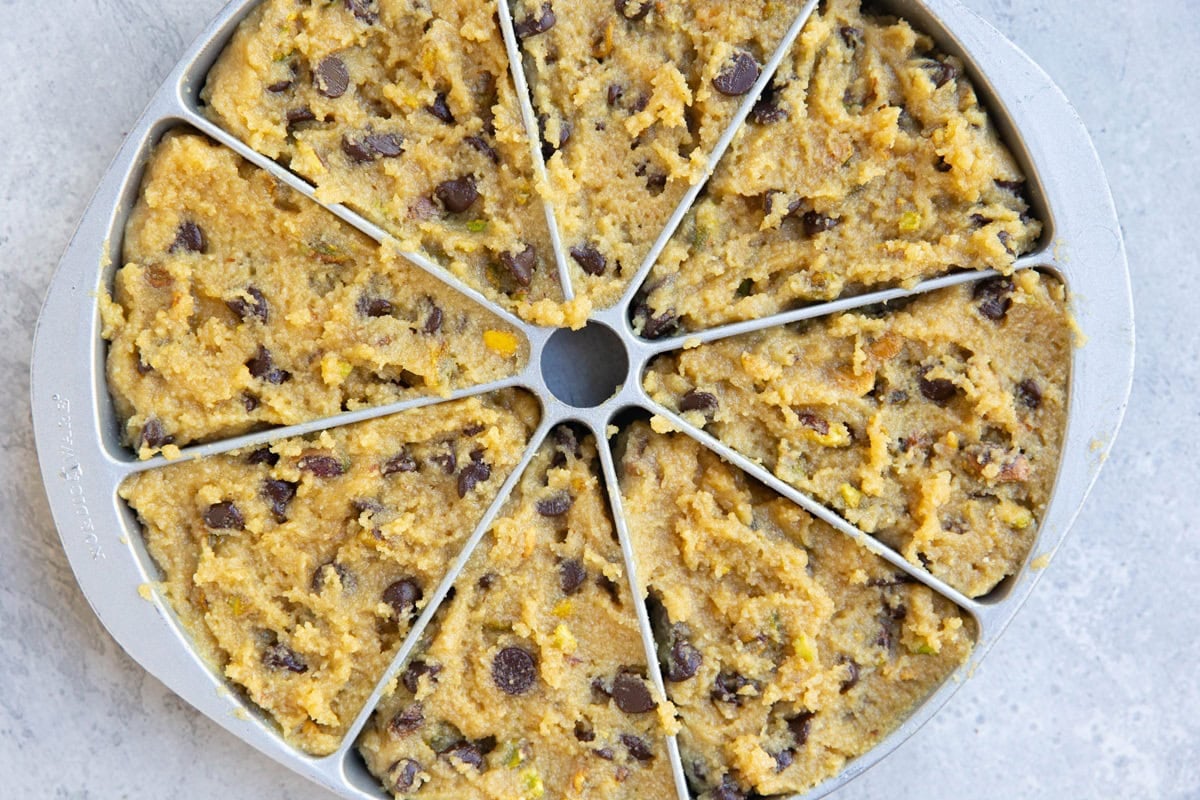 Scone pan full of pistachio scone dough, ready to go into the oven.