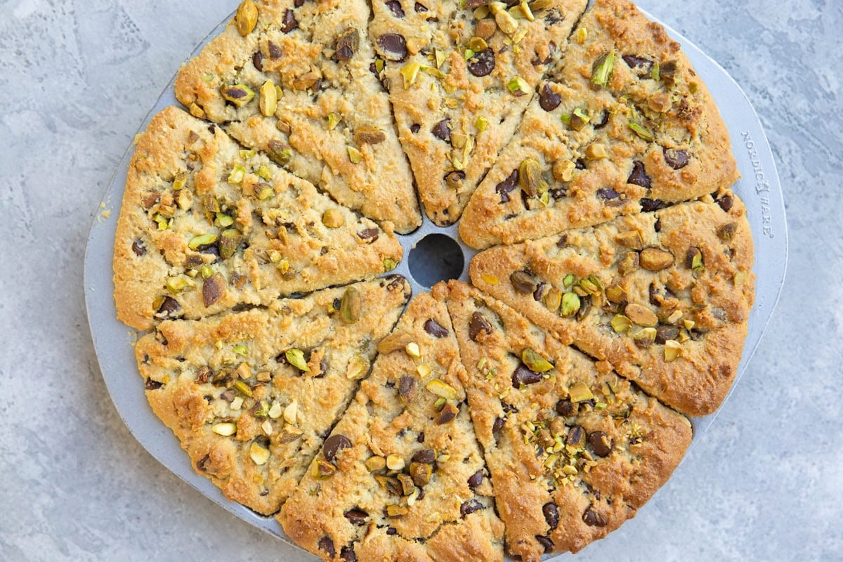 Scone pan with pistachio scones inside, fresh out of the oven.
