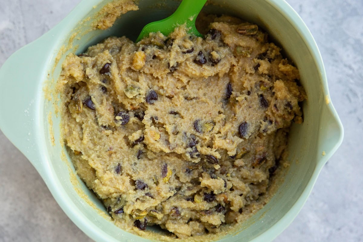 Mixing bowl full of pistachio scone dough.