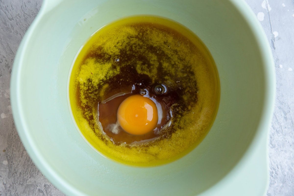 Mixing bowl with melted butter, sugar, and egg.