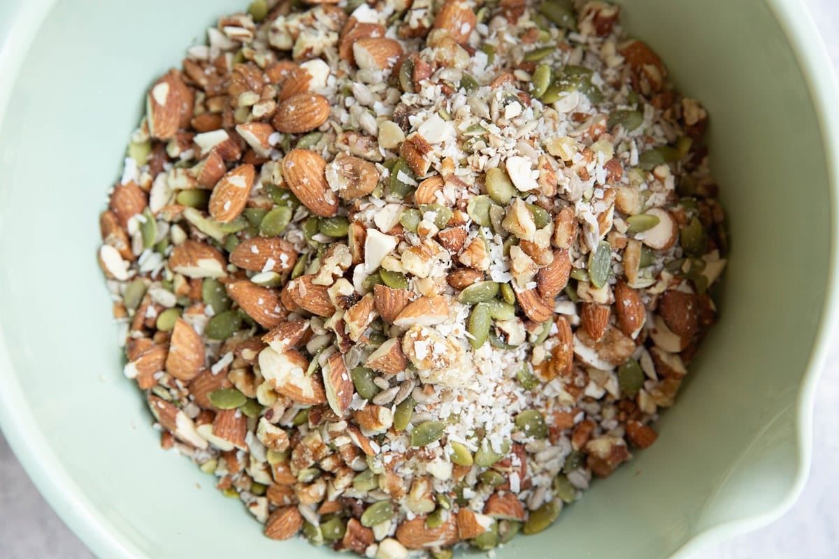 Mixing bowl full of chopped nuts and seeds.