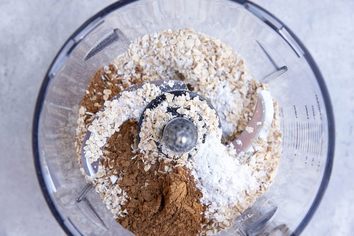Oats, pumpkin spice, baking powder, and salt in a food processor.